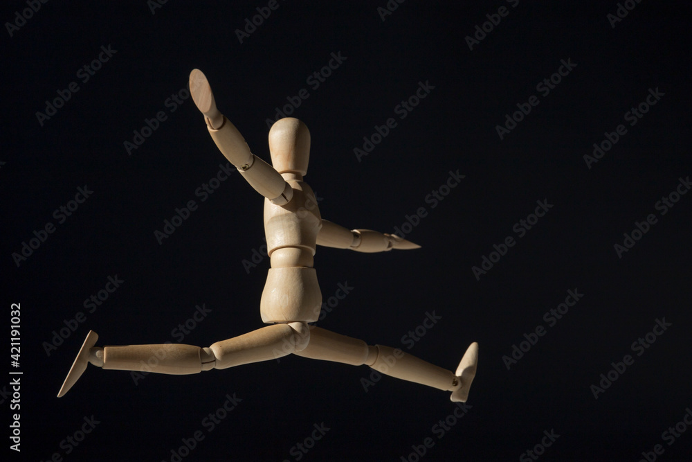 Wooden mannequin happy jump. Creative happiness concept. Wooden mannequin happy jump. Creative happiness concept.