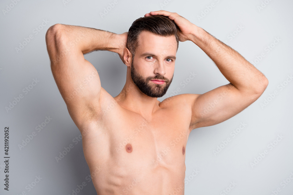 Photo of young handsome serious man enjoy hair treatment conditioner isolated over grey color background Photo of young handsome serious man enjoy hair treatment conditioner isolated over grey color background