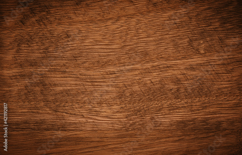 Dark brown with remnants of black paint wooden background texture