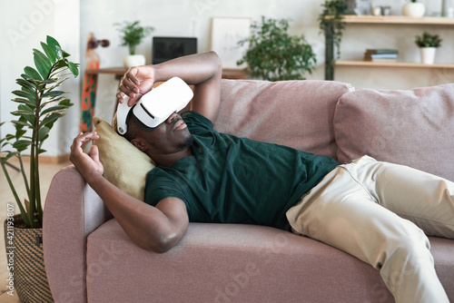 Man relaxing on the sofa at home