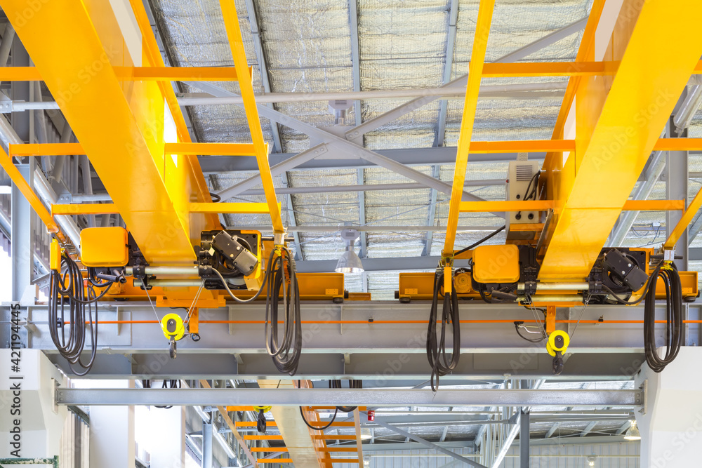 Overhead crane inside factory or warehouse. That industrial machinery