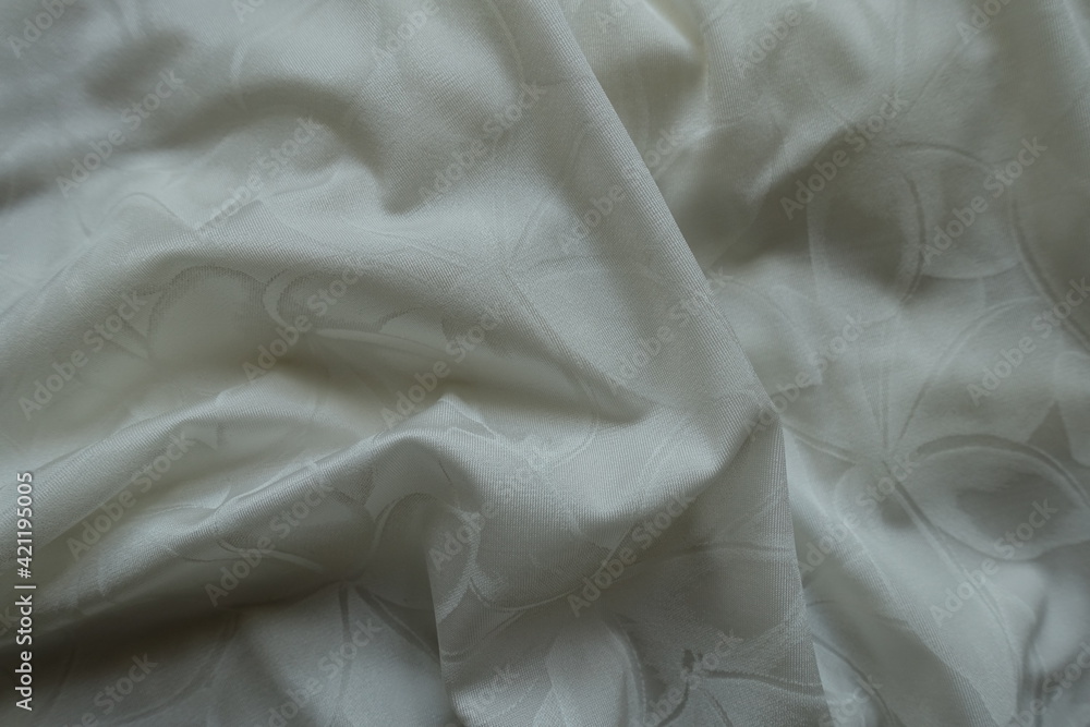 Crumpled thin white polyamide fabric with floral pattern Crumpled thin white polyamide fabric with floral pattern