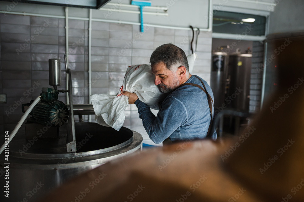 man working in mini craft brewery man working in mini craft brewery