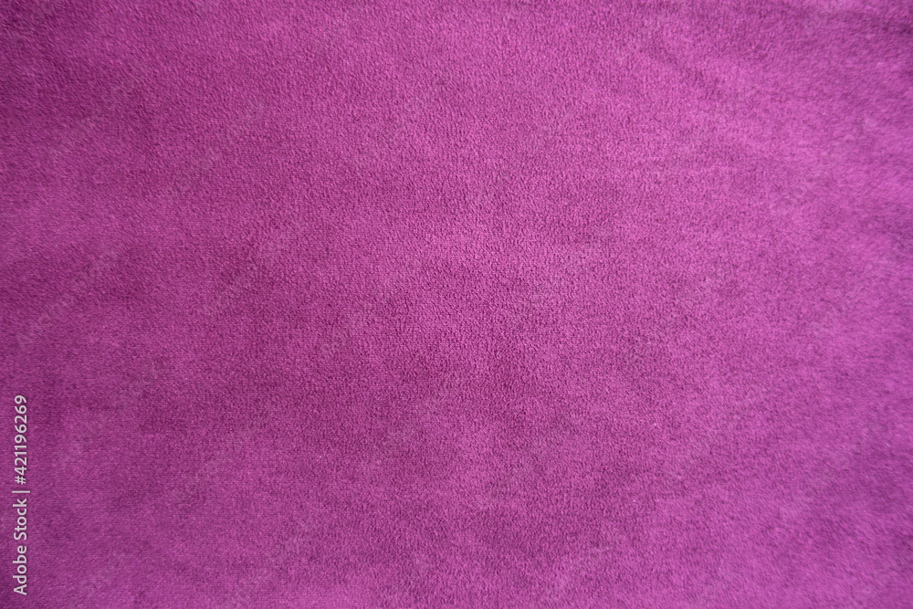 Magenta colored faux suede fabric from above Magenta colored faux suede fabric from above