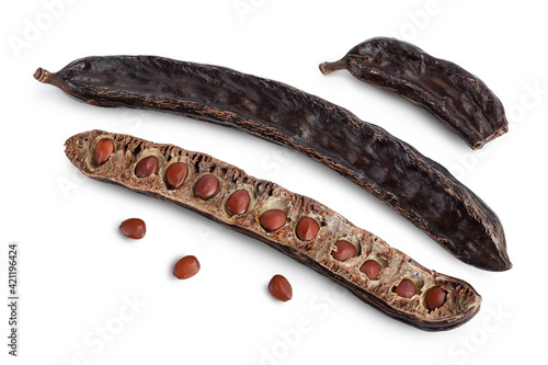 Ripe carob pods and bean isolated on white background with clipping path and full depth of field