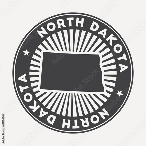 North Dakota round logo. Vintage travel badge with the circular name and map of us state, vector illustration. Can be used as insignia, logotype, label, sticker or badge of the North Dakota.