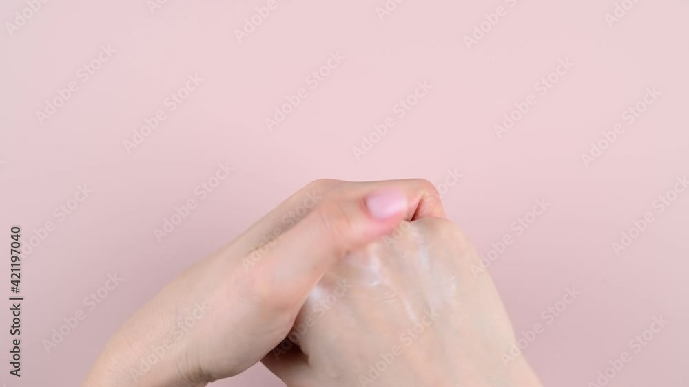 Girl smears hand cream, top view. High quality video Girl smears hand cream, top view. High quality video