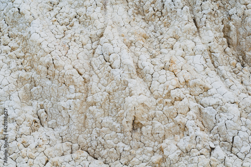 Close-up white clay texture, background from light soil surface, material outdoors