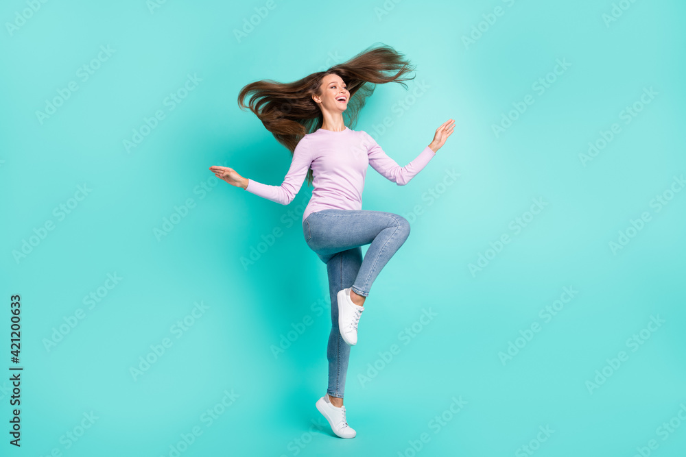 Full length body size view of charming cheerful girl jumping having fun good mood isolated over turquoise bright color background