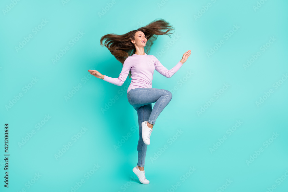 Obraz premium Full length body size view of charming cheerful girl jumping having fun good mood isolated over turquoise bright color background