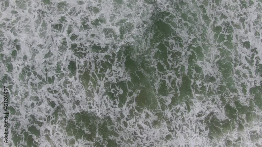 Beautiful top-down view from the drone camera on the foamy waves of the Mediterranean Sea Beautiful top-down view from the drone camera on the foamy waves of the Mediterranean Sea