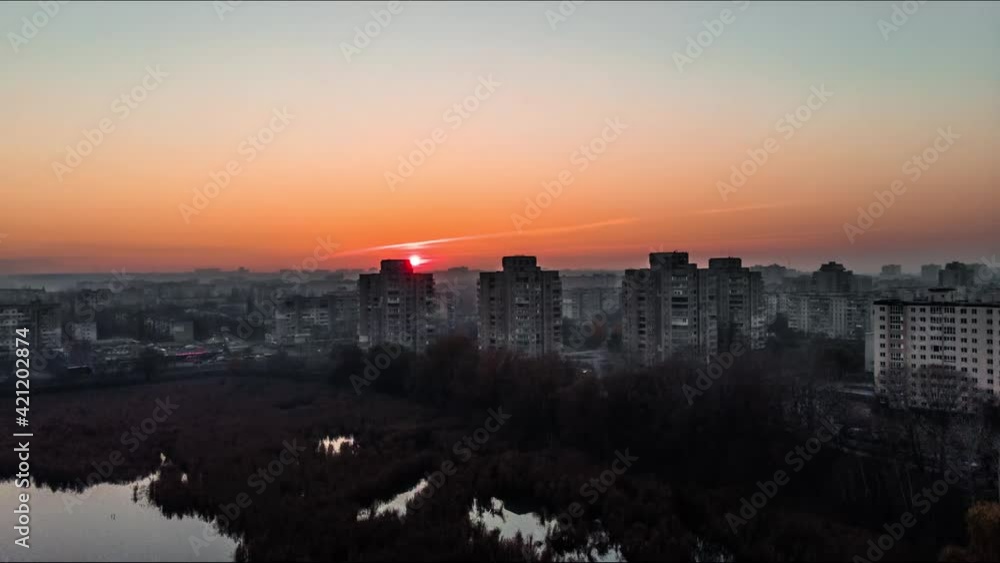 Incredible sunset from a drone. Fly over Lake Cecha with a view of the houses and the setting sun. Timelapse hyperlapse Ukraine. Sumy city from above. Incredible sunset from a drone. Fly over Lake Cecha with a view of the houses and the setting sun. Timelapse hyperlapse Ukraine. Sumy city from above.