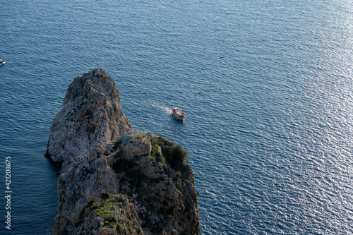 person on a rock photo