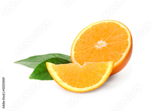 Cut fresh ripe orange with green leaves on white background