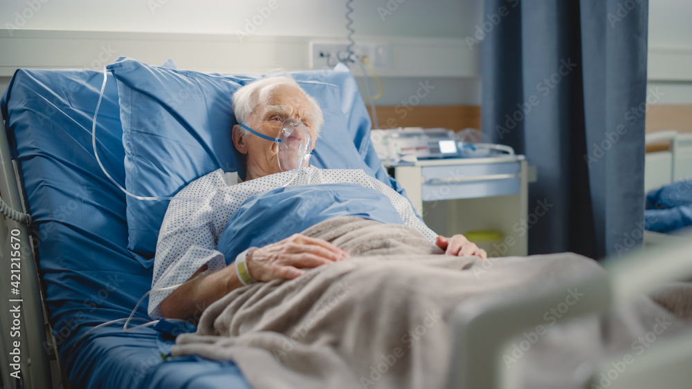 Hospital Ward Portrait of Elderly Man Wearing Oxygen Mask Resting in