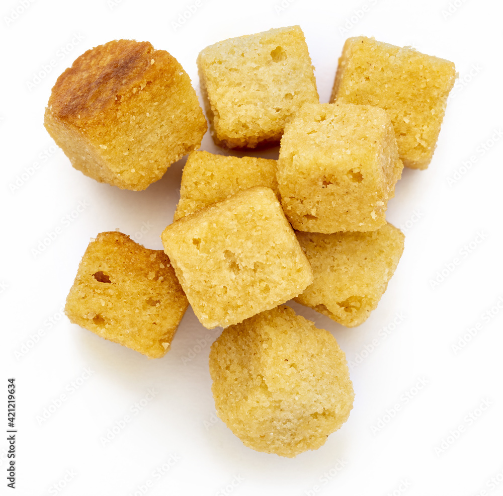 Cluster crispy croutons. Cubes of bread toasted and fried in oil. Isolated white background Cluster crispy croutons. Cubes of bread toasted and fried in oil. Isolated white background