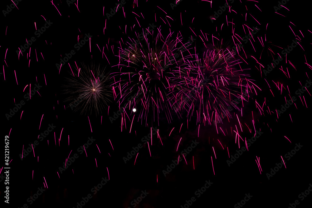 Full moon and fireworks filling the night sky Full moon and fireworks filling the night sky