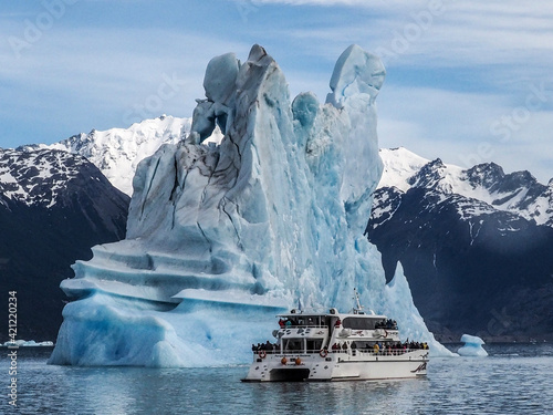 High icebergs and catamaran float in the Lago Argentino, El Calafate, Argentina. photo
