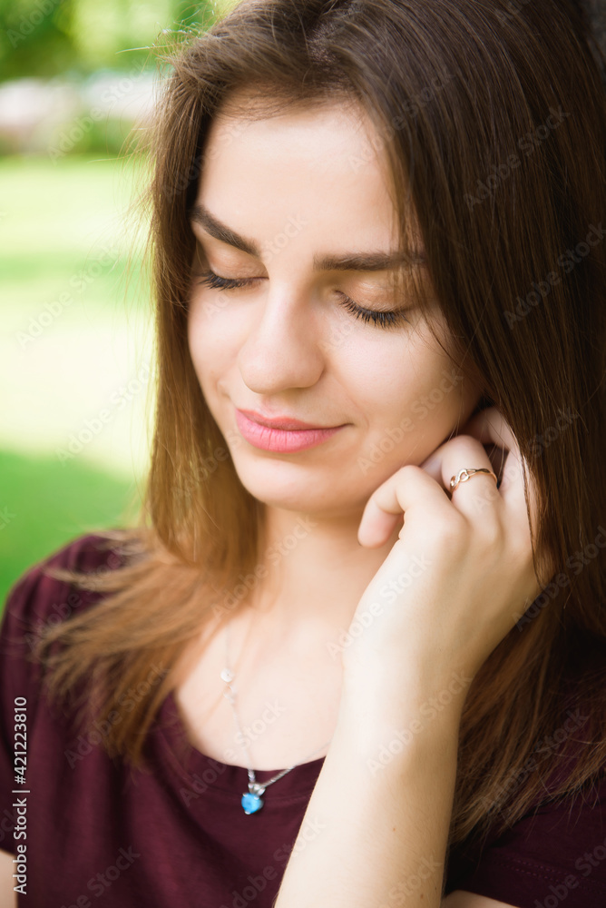 Attractive young woman enjoying her time outside in the park. Attractive young woman enjoying her time outside in the park.