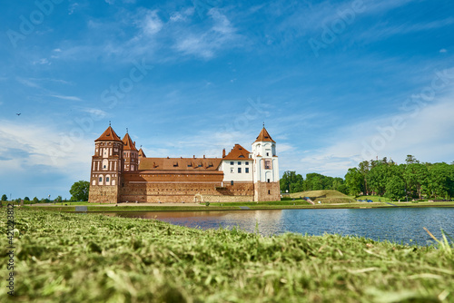 Mir castle complex in a summer day with blue cloudy sky. Tourism landmark in Belarus, cultural monument, old fortress photo