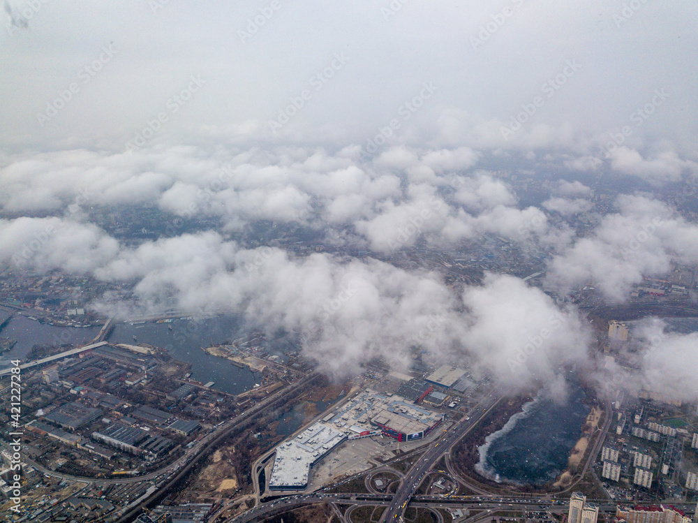 Aerial high view. Flight over the clouds of Kiev.