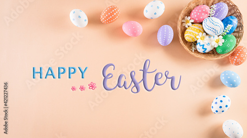 Happy easter! Colourful of Easter eggs in the nest on pastel background. Greetings and presents for Easter Day celebrate time. Flat lay ,top view. © Siam