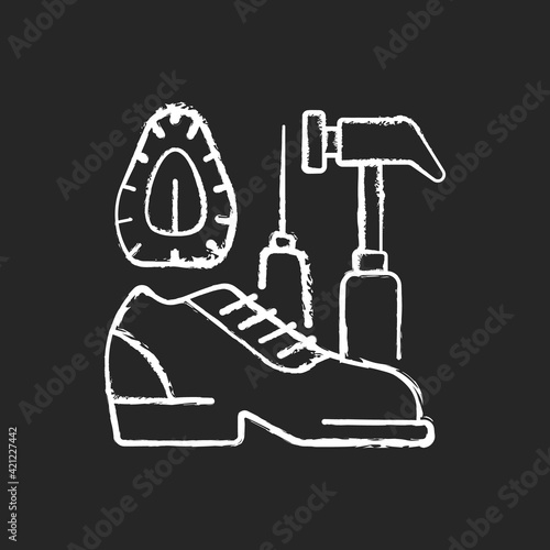 Shoe repair and reconditioning chalk white icon on black background. Professional shoemaker. I Garment restoration. Clothing alteration and repair services. Isolated vector chalkboard illustration