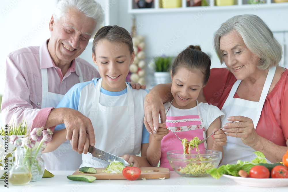 family cooking together in kitchen