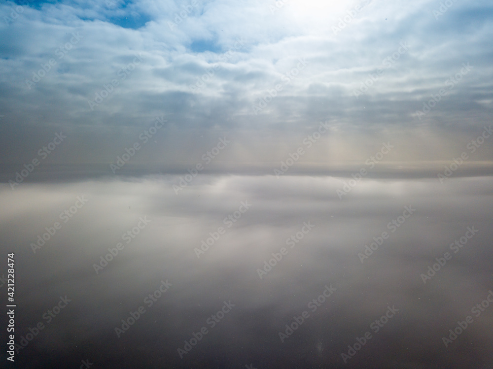 Aerial high view. Flying over the clouds.