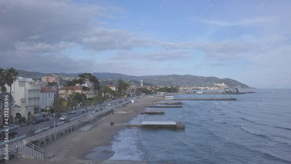 Aerial view on Diano Marina beach coast bay shore summer blue sky in Imperia, Liguria, Italy. Mediterranean Sea Aerial view on Diano Marina beach coast bay shore summer blue sky in Imperia, Liguria, Italy. Mediterranean Sea