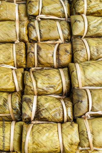 Thai desserts wrapped in banana leaves