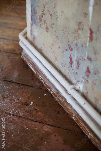 Wallpaper Mural Renovation of an apartment in an old building with a charmingly full wooden floor, paint build-up on the high wall and old heating pipes construction site do-it-yourself repair painting work training Torontodigital.ca