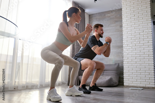 Fit young couple stretching their bodies. healthy lifestyle exercise at home, workout