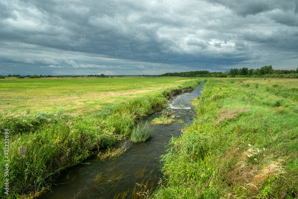 The small river Uherka flowing through the meadows The small river Uherka flowing through the meadows