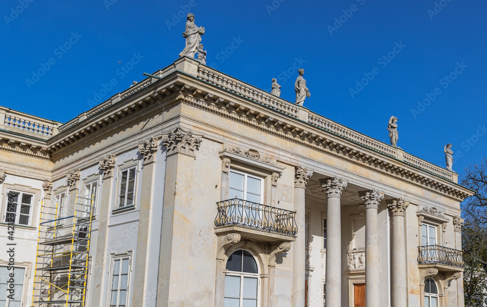 Obraz premium Facade of Palace on the Water in Royal Baths Park, Lazienki Park, one of the most famous parks in Warsaw, Poland