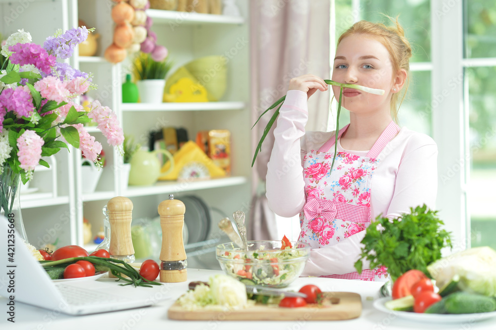 teen girl preparing fresh salad teen girl preparing fresh salad