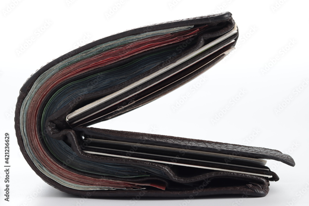 thick loaded brown leather wallet isolated in white background thick loaded brown leather wallet isolated in white background