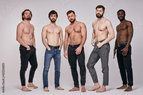 Tableau sur toile Portrait of shirtless diverse men posing seriously at camera, sexy guys in jeans