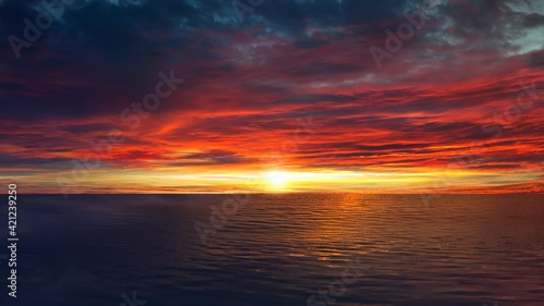 Colorful sunset sky over tranquil sea surface 