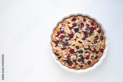 Freshly baked homemade summer berry cake on white background. Copy space. Sweet food.