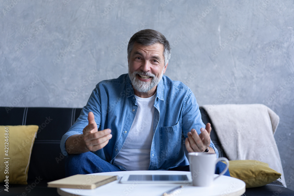 Happy senior retired man blogger looking at camera recording vlog, webcamera view portrait Happy senior retired man blogger looking at camera recording vlog, webcamera view portrait