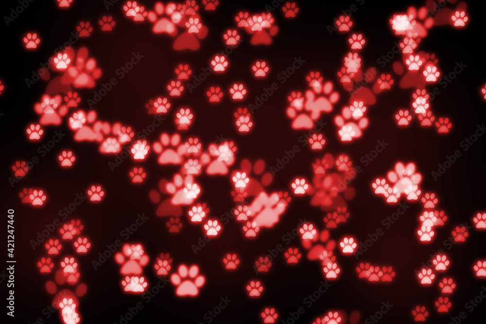 Black background with red glowing bokeh paws. Animal care concept.