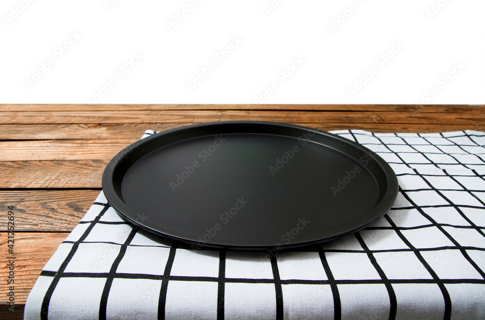 Baking dish. Plaid tablecloth on brown wooden table isolated background. Mock up and top view. Kitchen Copy space and empty place for food. Thanksgiving day. Pie, dessert and biscuit clean bakery form