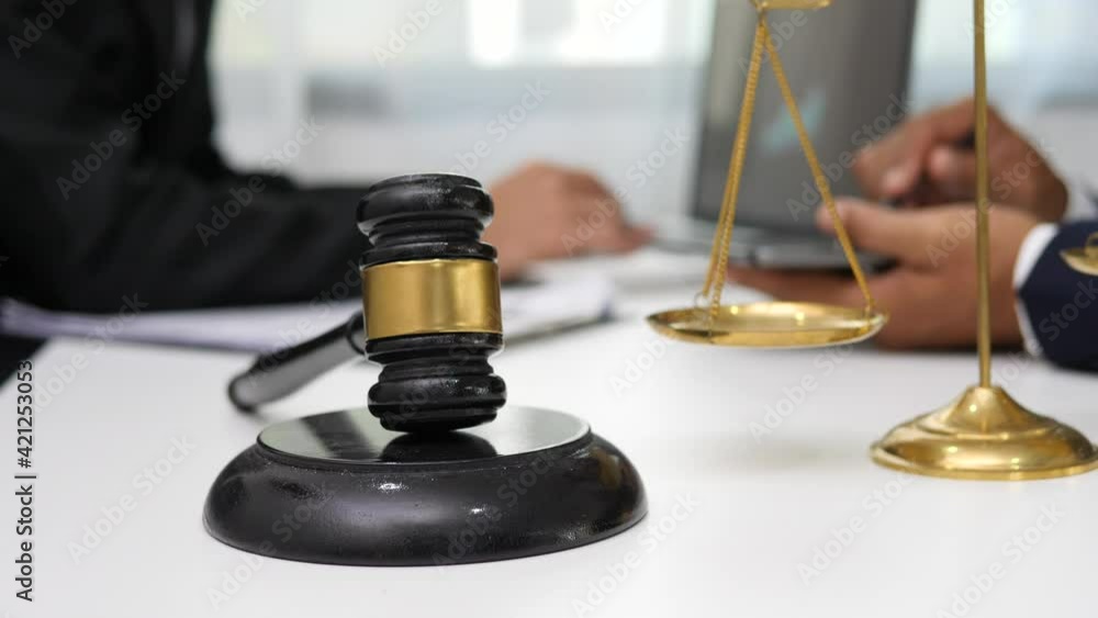 Male lawyer or judge consult having team meeting with client, Law and Legal services concept Male lawyer or judge consult having team meeting with client, Law and Legal services concept