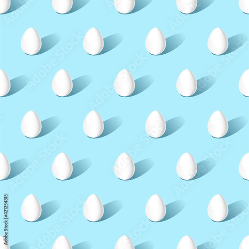 White Easter eggs at an isometric projection on  blue background. Seamless pattern.  Texture for fabric, wrapping, wallpaper. Decorative print. Vector illustration 