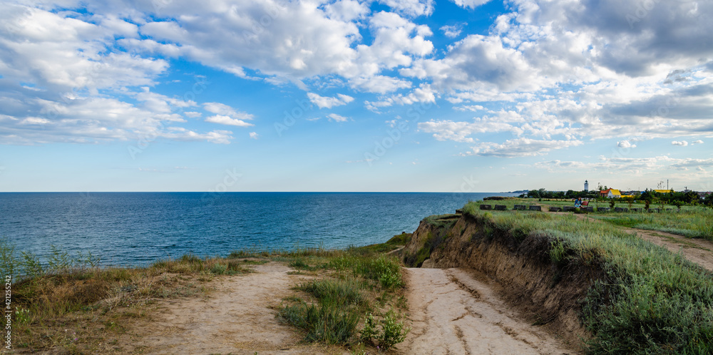 Seascape panorama road to the sea and sky with clouds