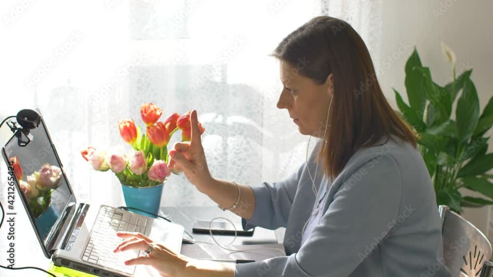 Business woman typing on laptop computer working at home using  internet. Female professional working notebook at home  