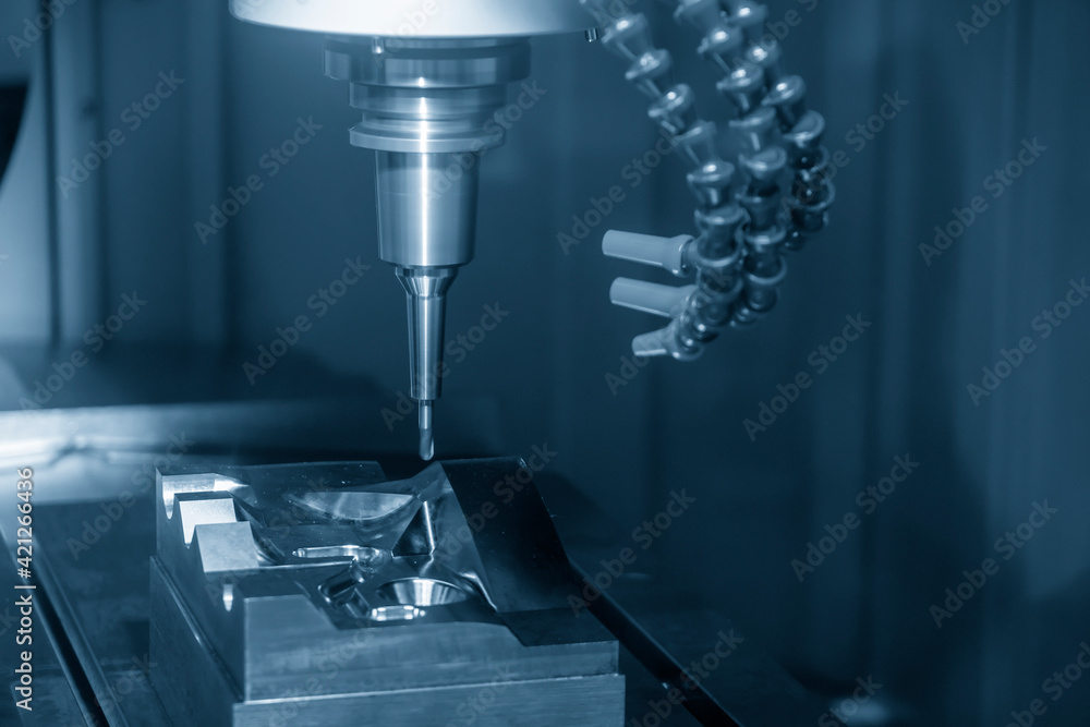 The CNC milling machine cutting the mold parts by solid ball end-mill tool. The hi-precision mold and die manufacturing concept by machining center. The CNC milling machine cutting the mold parts by solid ball end-mill tool. The hi-precision mold and die manufacturing concept by machining center.