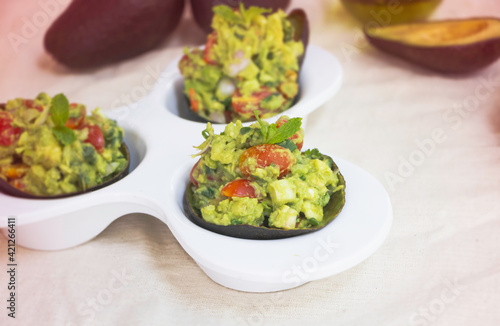 In selective focus of Avocado salad mixed,serving on white bowl
