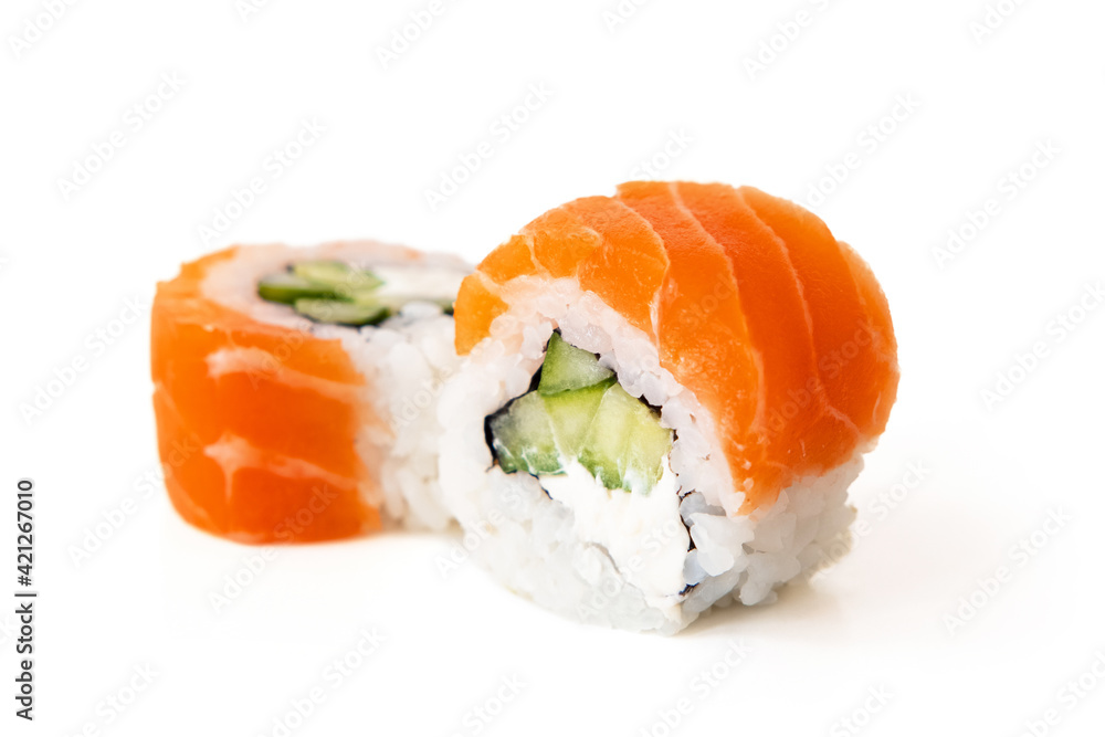 Salmon sushi maki rolls with avocado and cucumber filling, isolated on white background Salmon sushi maki rolls with avocado and cucumber filling, isolated on white background